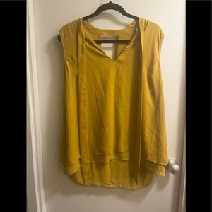 Mustard colored sleeveless top